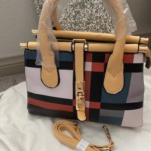 Color Block Medium Handbag with Shoulder Strap Included.